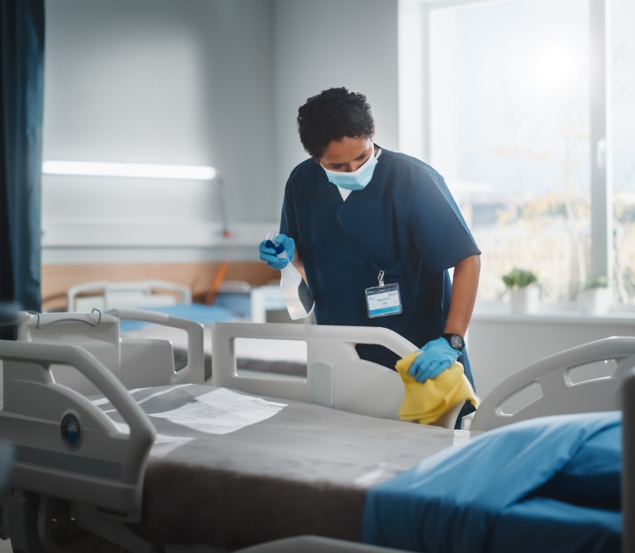 medical cleaning company cleaning a hospital bed