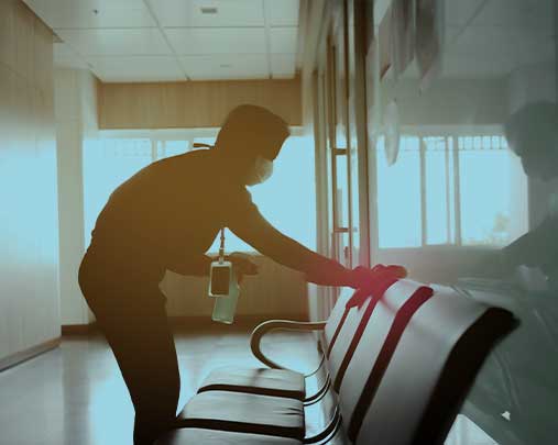 Man cleaning seat with cloth