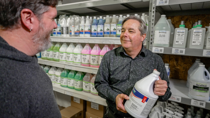 GT French's Cam Carnegie talking with customer about cleaning valuation and Enviro Solutions cleaning products