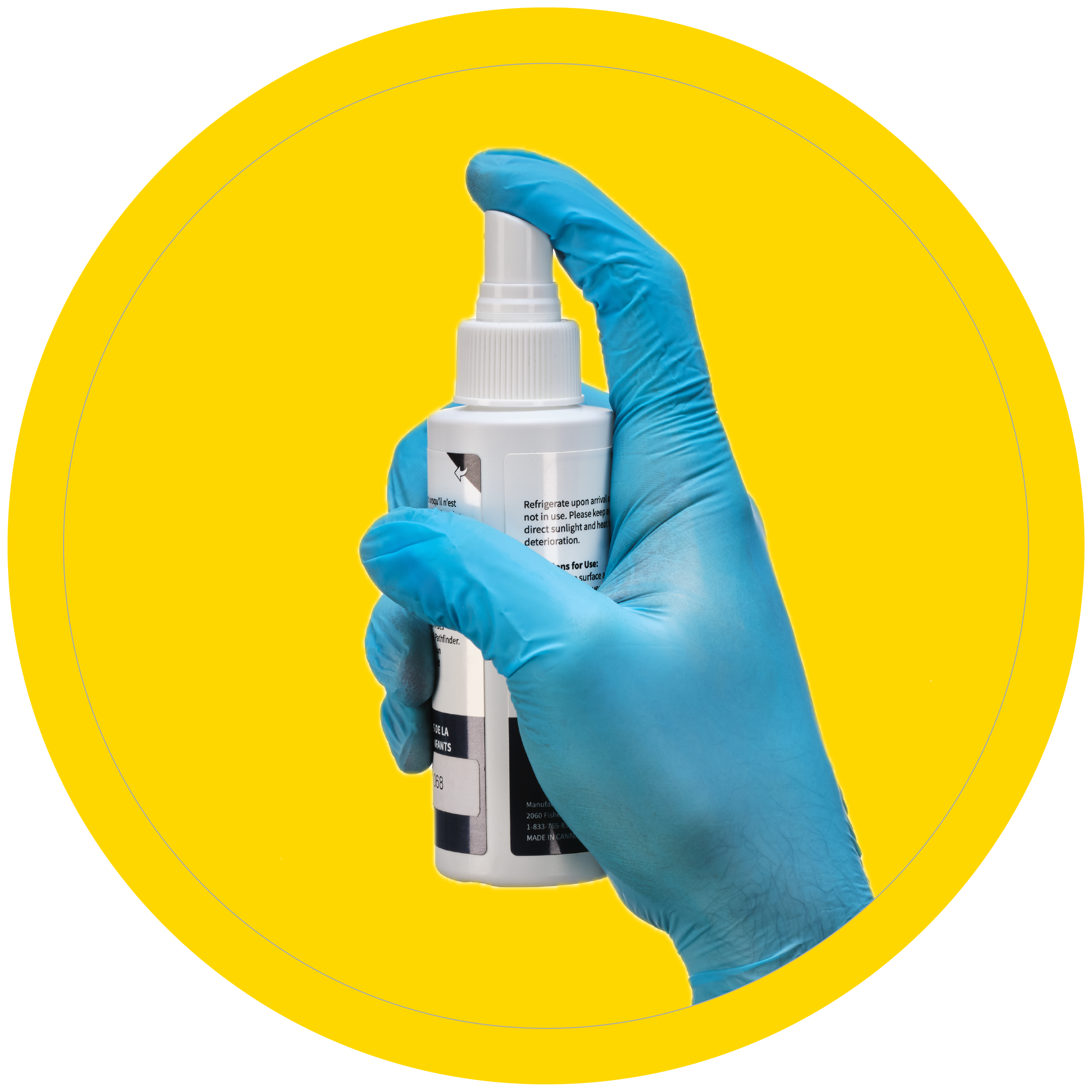 A gloved hand holding a bottle of illuminator spray used with the Pathfinder